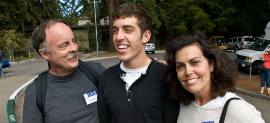 Photo of parents and their student at orientation 